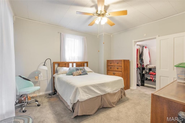 bedroom featuring light carpet, a closet, and ceiling fan