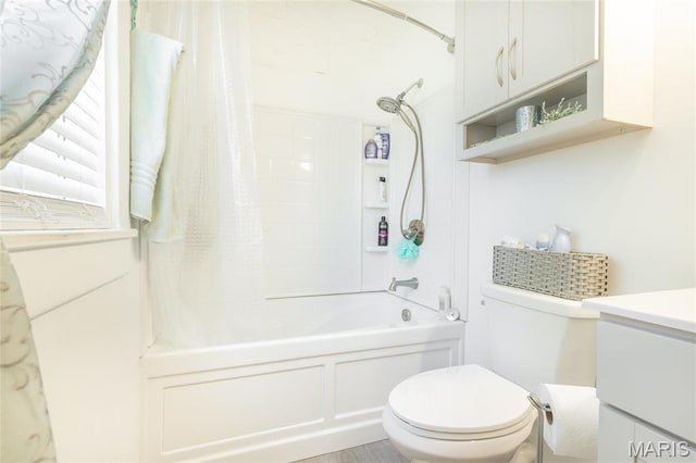 bathroom featuring toilet, shower / bathtub combination with curtain, and vanity