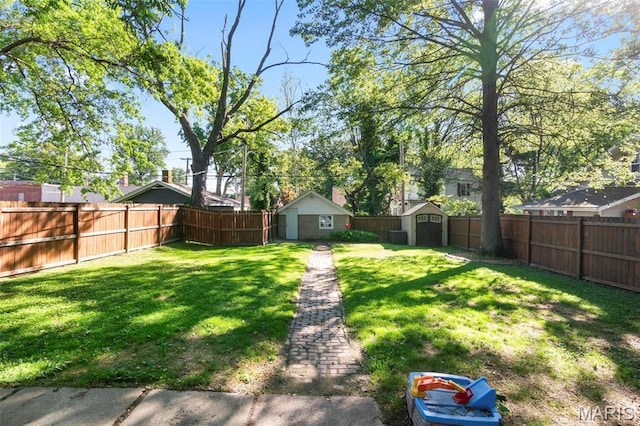 111 Portland Ave, Belleville, IL 62220 - view of yard with a storage shed and an outbuilding