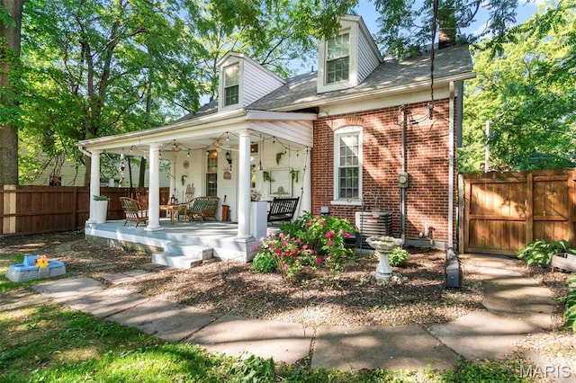 111 Portland Ave, Belleville, IL 62220 - view of front of property featuring a porch, fence, and brick siding