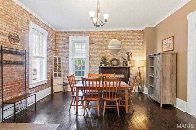 111 Portland Ave, Belleville, IL 62220 - dining area with brick wall, a chandelier, wood-type flooring, and baseboards