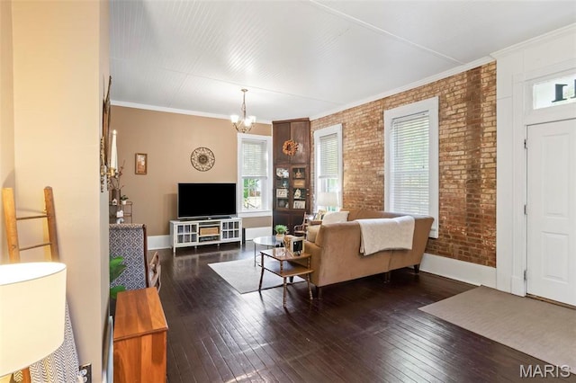 111 Portland Ave, Belleville, IL 62220 - living area featuring brick wall, baseboards, wood-type flooring, a chandelier, and ornamental molding