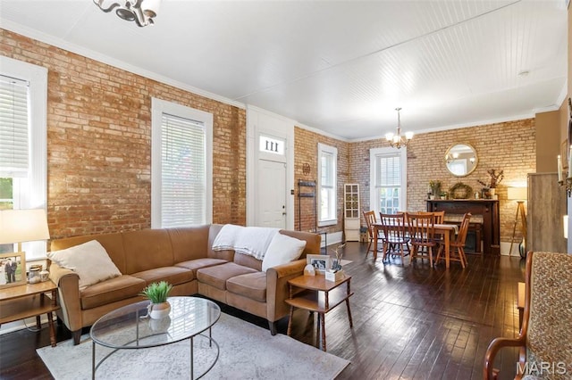 111 Portland Ave, Belleville, IL 62220 - living room with brick wall, a chandelier, dark wood-style floors, and crown molding