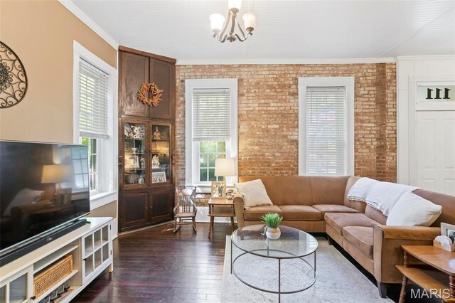 111 Portland Ave, Belleville, IL 62220 - living area featuring brick wall, a chandelier, healthy amount of natural light, dark wood-type flooring, and crown molding