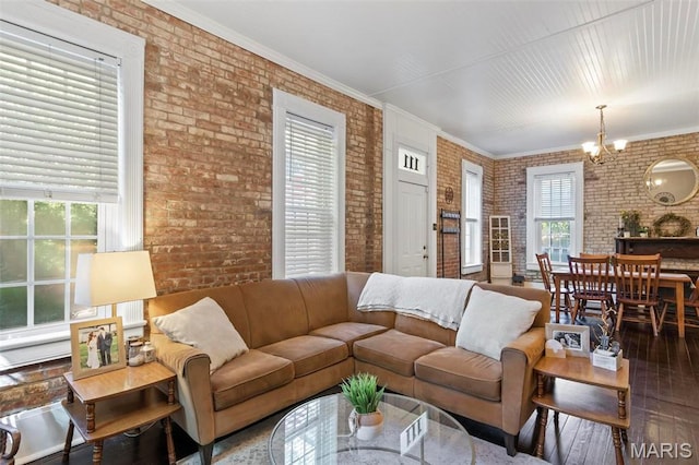 111 Portland Ave, Belleville, IL 62220 - living area with brick wall, wood-type flooring, healthy amount of natural light, and a chandelier