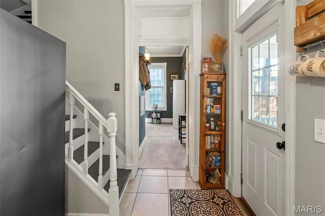 111 Portland Ave, Belleville, IL 62220 - entrance foyer featuring stairway, ornamental molding, light tile patterned floors, light colored carpet, and baseboards