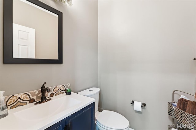 half bath with toilet and vanity