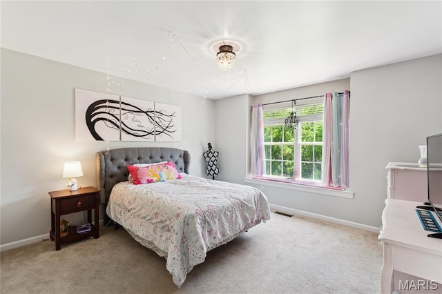 bedroom featuring carpet and baseboards