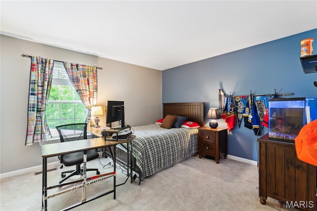 bedroom with carpet floors, baseboards, and a desk