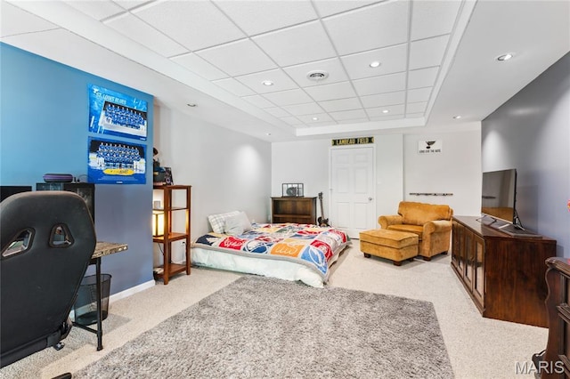 carpeted bedroom with a raised ceiling, baseboards, and recessed lighting