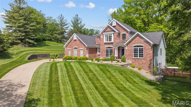 traditional-style home featuring brick siding