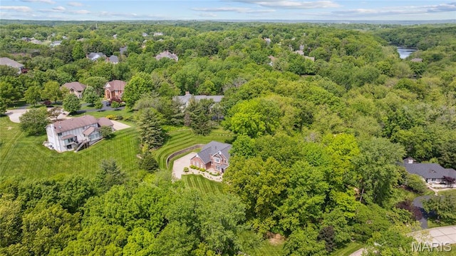drone / aerial view of a heavily wooded area