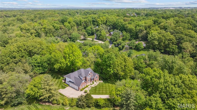 view from above of property with a forest