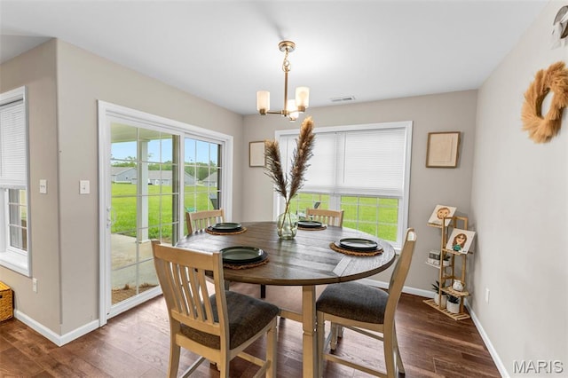 710 Skye View Ct, Farmington, MO 63640 - dining room with a chandelier, wood finished floors, and baseboards