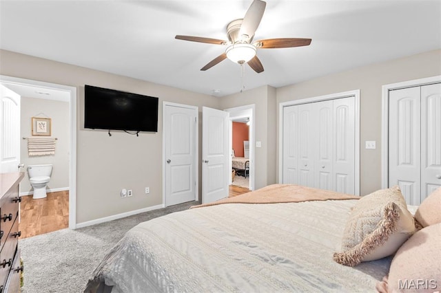 710 Skye View Ct, Farmington, MO 63640 - carpeted bedroom with two closets, baseboards, ensuite bathroom, and ceiling fan
