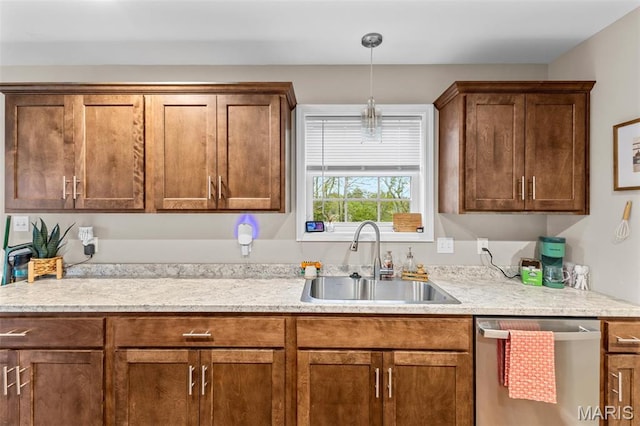710 Skye View Ct, Farmington, MO 63640 - kitchen featuring stainless steel dishwasher, a sink, light countertops, and decorative light fixtures