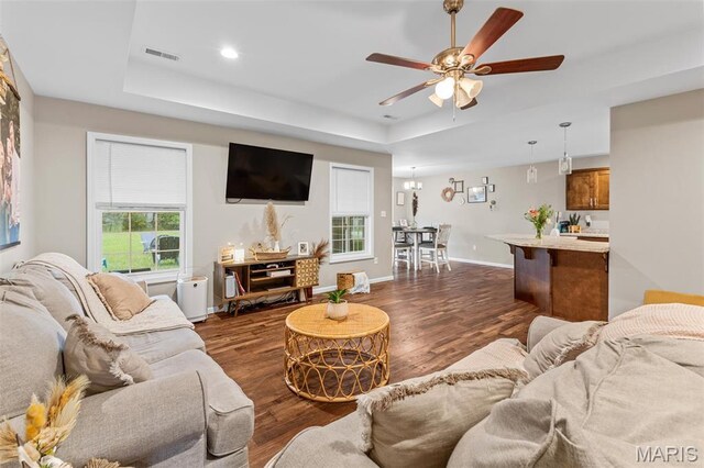 710 Skye View Ct, Farmington, MO 63640 - living room featuring a raised ceiling, dark wood finished floors, ceiling fan, baseboards, and recessed lighting