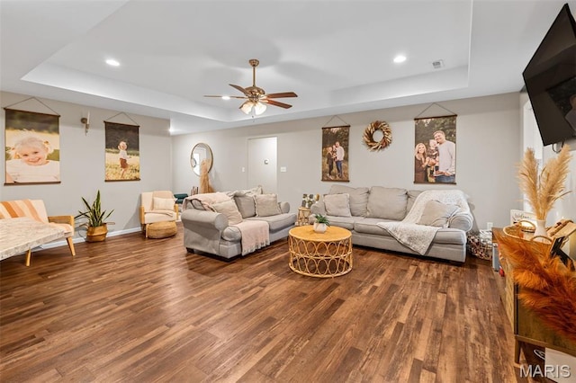 710 Skye View Ct, Farmington, MO 63640 - living room with a tray ceiling, dark wood-style flooring, ceiling fan, recessed lighting, and baseboards
