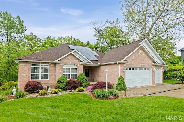 view of front of home with brick siding, a shingled roof, a front yard, and an attached garage