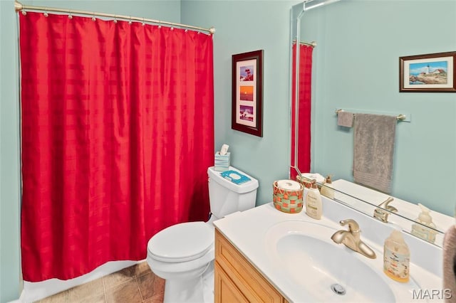 bathroom with toilet, vanity, and a shower with curtain