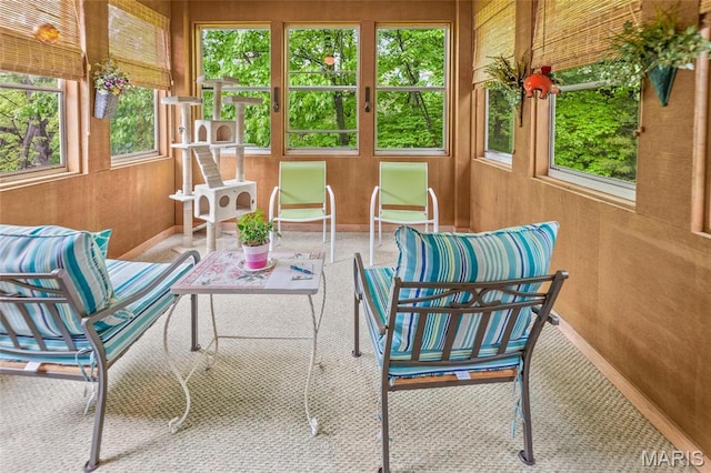 sunroom with wood walls