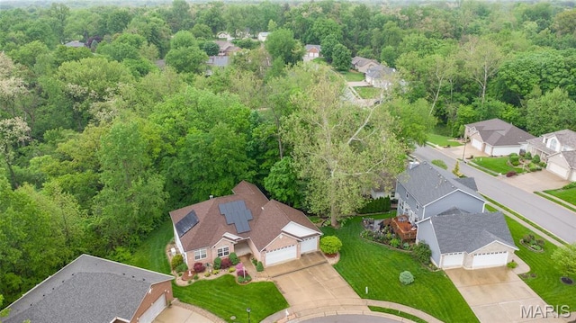 aerial view of residential area with a forest