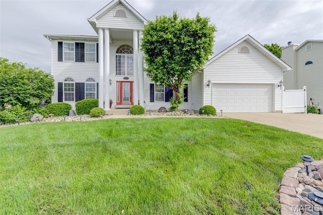 5443 Westwood Dr, Saint Charles, MO 63304 - neoclassical / greek revival house with concrete driveway, a garage, and a front yard