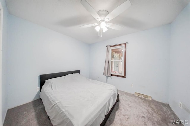 bedroom with carpet and a ceiling fan