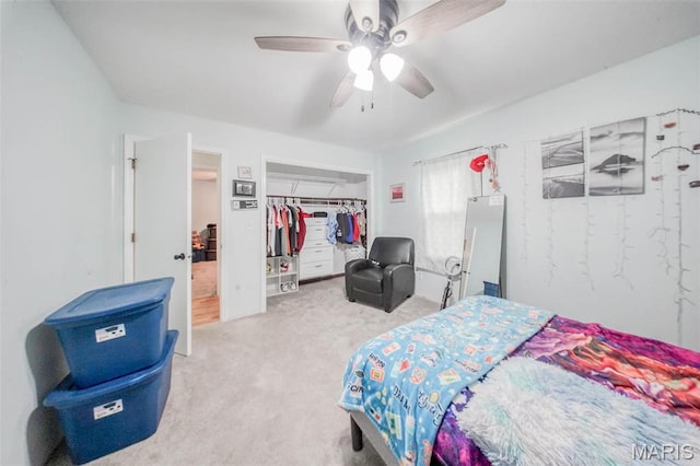 carpeted bedroom with a closet and ceiling fan