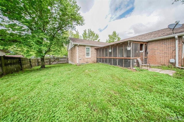 view of yard featuring a sunroom
