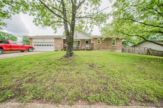 ranch-style house featuring brick siding, an attached garage, and driveway