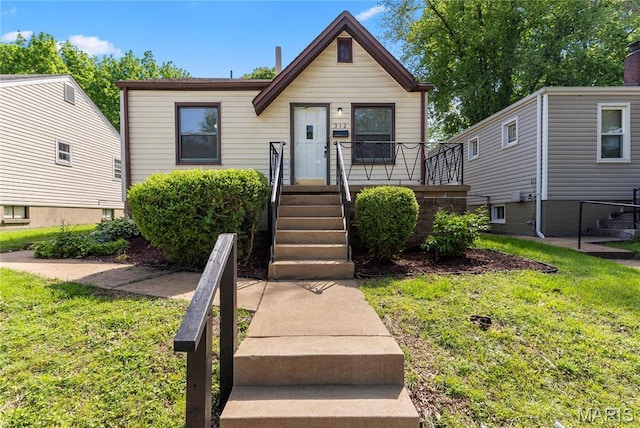 312 Waller Ave, Saint Louis, MO 63125 - view of front of house featuring a front lawn
