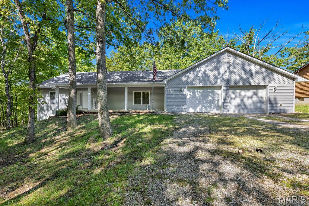 1340 Gainsborough Ct, Marthasville, MO 63357 - ranch-style house with a garage