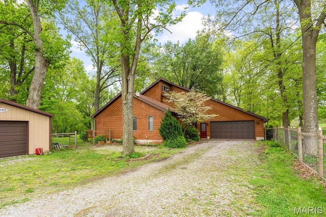 22000 E Rd, Carlyle, IL 62231 - view of front facade with fence and a garage