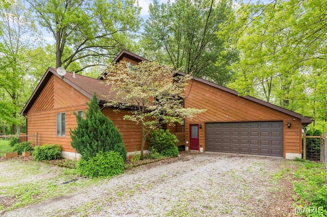 22000 E Rd, Carlyle, IL 62231 - view of front facade with gravel driveway and an attached garage