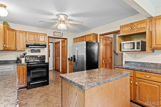 22000 E Rd, Carlyle, IL 62231 - kitchen featuring black range with electric cooktop, stainless steel fridge, white microwave, under cabinet range hood, and a ceiling fan