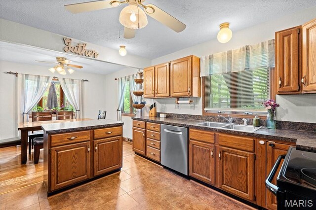 22000 E Rd, Carlyle, IL 62231 - kitchen featuring dishwasher, ceiling fan, a sink, black range with electric cooktop, and a textured ceiling