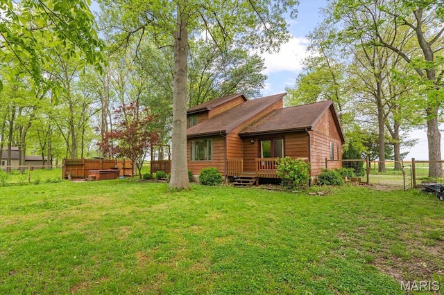 22000 E Rd, Carlyle, IL 62231 - back of house with a hot tub and a wooden deck