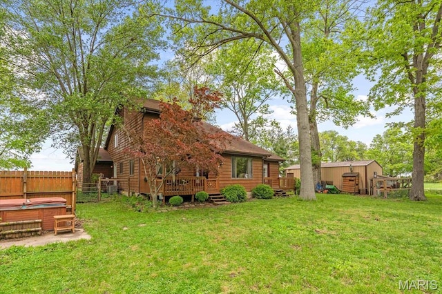 22000 E Rd, Carlyle, IL 62231 - rear view of house with a hot tub and a wooden deck