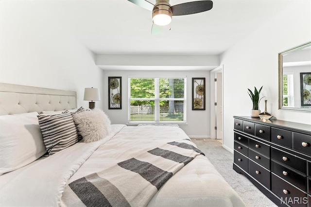 bedroom with carpet, baseboards, and a ceiling fan