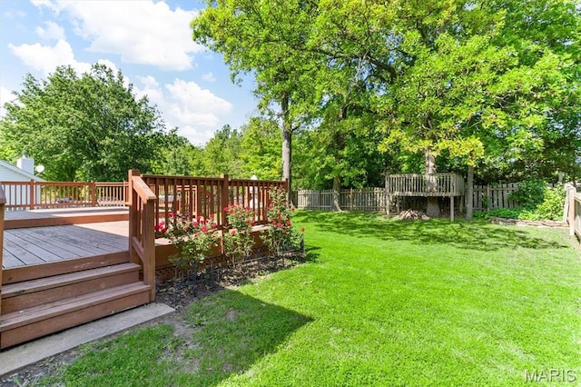 view of yard with a wooden deck
