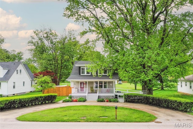 721 Taylor Ave, Godfrey, IL 62035 - view of front of home featuring a porch and curved driveway