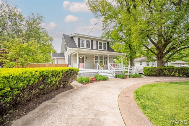 721 Taylor Ave, Godfrey, IL 62035 - view of front of home featuring a porch and fence
