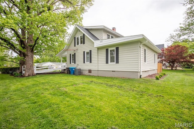 721 Taylor Ave, Godfrey, IL 62035 - back of property featuring crawl space, a lawn, cooling unit, and a chimney