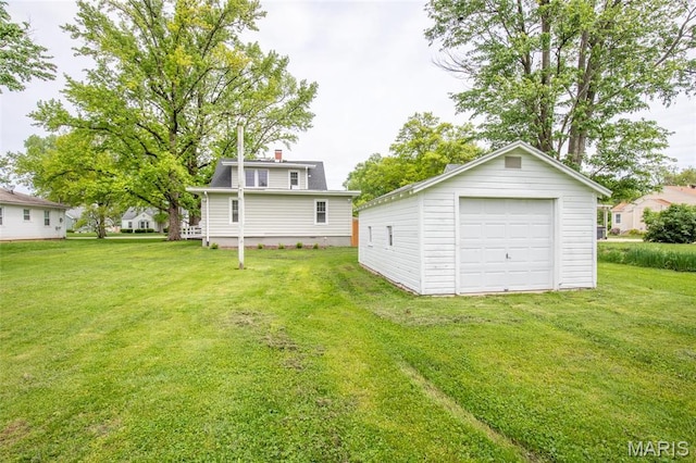 721 Taylor Ave, Godfrey, IL 62035 - view of green lawn with an outbuilding and a detached garage