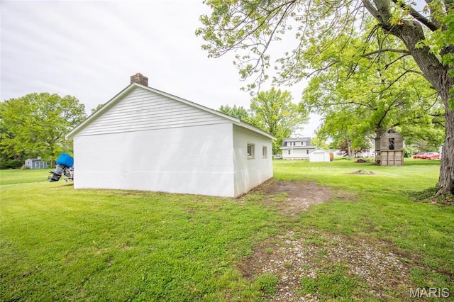 721 Taylor Ave, Godfrey, IL 62035 - view of side of property featuring a chimney and a lawn