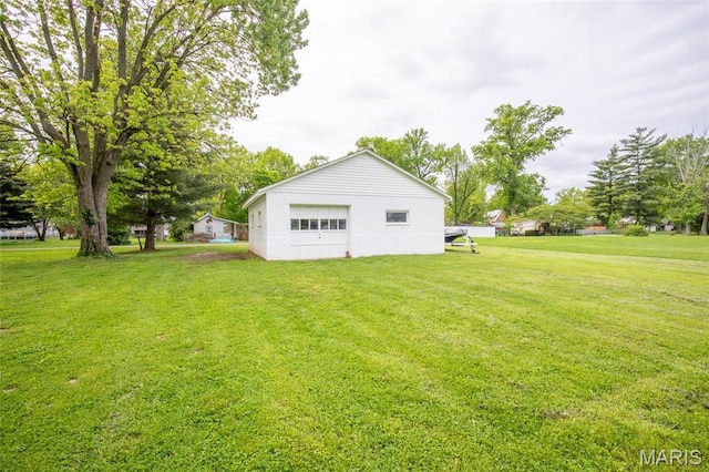 721 Taylor Ave, Godfrey, IL 62035 - back of house featuring a yard and an outbuilding