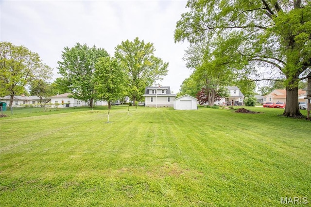 721 Taylor Ave, Godfrey, IL 62035 - view of grassy yard featuring a garage, an outbuilding, and a storage unit