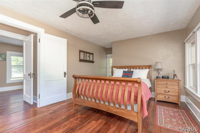 721 Taylor Ave, Godfrey, IL 62035 - bedroom with wood finished floors, baseboards, a textured ceiling, and ceiling fan