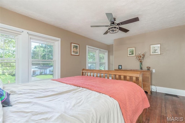 721 Taylor Ave, Godfrey, IL 62035 - bedroom with wood finished floors, baseboards, a ceiling fan, and a textured ceiling